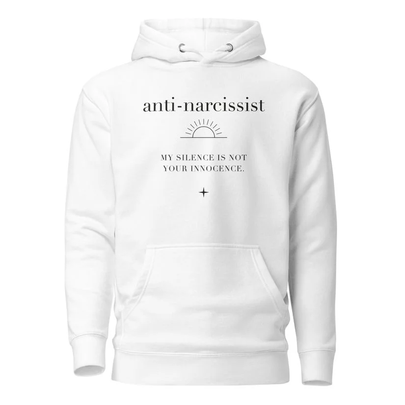 White premium hoodie with My Silence Is Not Your Innocence artwork.